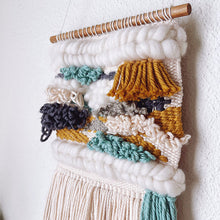 Load image into Gallery viewer, Charcoal, mustard, cream and teal woven wall art close up hanging on wooden dowel