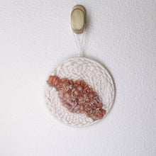 Load image into Gallery viewer, handcrafted round woven wall hanging with peach, coral and dusky rose, sand and cream wool and natural fibers